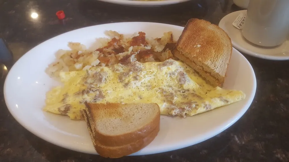 1 French Toast 1 Egg 1 Strip of Bacon or 1 Sausage